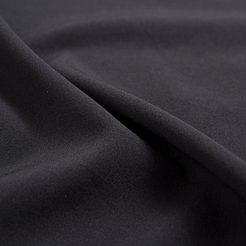 XSKF 100D 130gsm fyrsidigt stretchtyg (kaffekol)